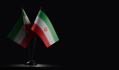 Small national flags of the Iran on a black background
