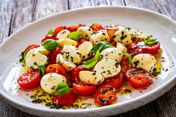 Caprese salad on wooden board
