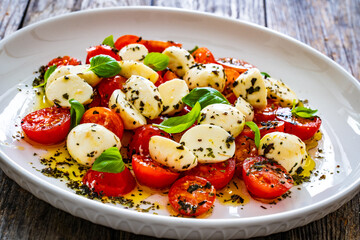 Caprese salad on wooden board
