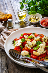 Caprese salad on wooden board
