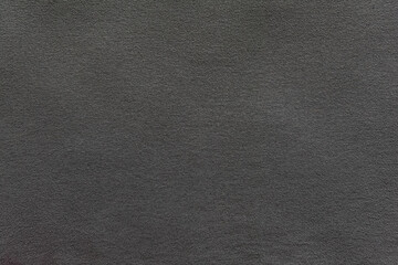 abstract background of old dark grey knit fabric texture close up