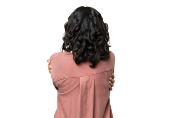 Young Argentinian woman over isolated background in back position