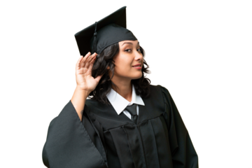 Young university graduate Argentinian woman over isolated background listening to something by putting hand on the ear