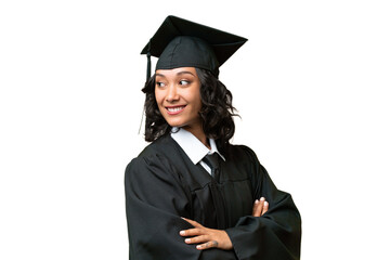 Young university graduate Argentinian woman over isolated background with arms crossed and happy