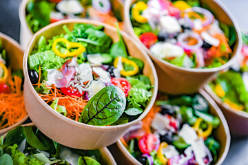 Paper boxes with pre-packaged vegetable salads ready for sale
