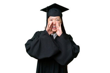 Young university graduate Asian woman over isolated background shouting and announcing something