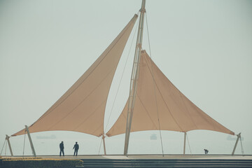 mast and canvas on seawall