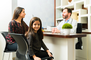 Adorable little girl at the doctor's office with her mother