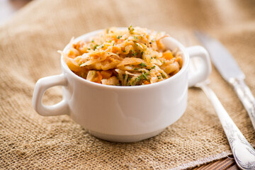 stewed cabbage with carrots and spices in a bowl