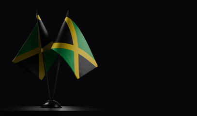 Obraz premium Small national flags of the Jamaica on a black background