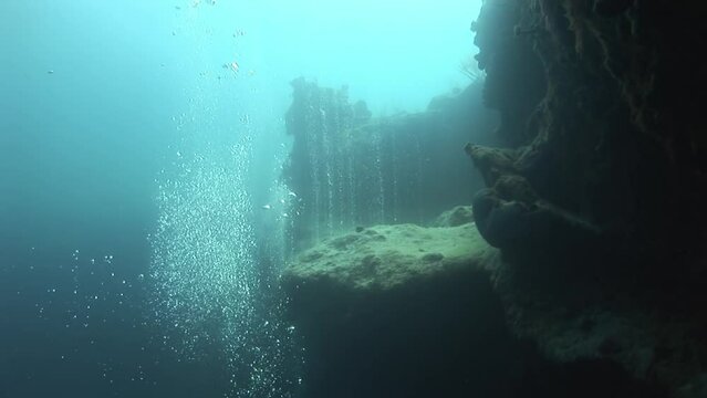 Bubbles near sea mounts in Caribbean Sea in Bahamas. There are many popular dive sites throughout Bahamas, with some of most famous being Andros Barrier Reef, Exumas, and Abacos.
