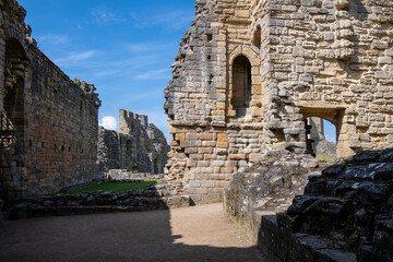 Close up of crumbling/ruined walls at Warkworth Castle in Northumberland, UK