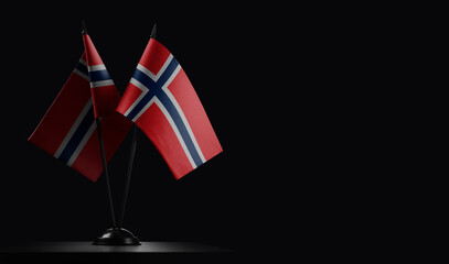 Small national flags of the Norway on a black background