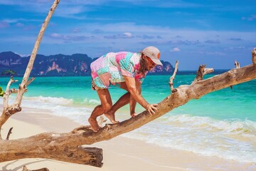 portrait of a man on the beach in krabi thailand with sunglasses, poda island, model shooting 