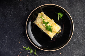 vegetable casserole eggplant, zucchini, green peas, cheese, bechamel sauce vegetables lasagne meal food snack on the table copy space food background rustic top view