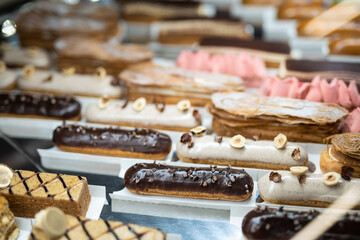various delicious sweet pastries in the shop window.