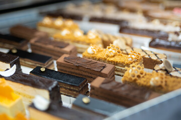 various delicious sweet pastries in the shop window.