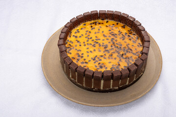 passion fruit pie decorated with chocolate cookies