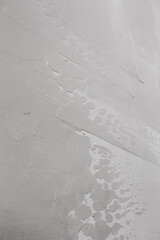 Interior finishing work on leveling walls - preparing the surface with putty for painting or wallpaper