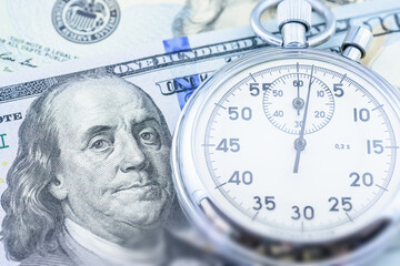 Time is money, value of asset growth over time, financial concept : US USD dollar with a stopwatch,...