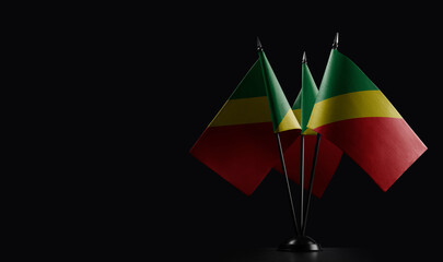 Small national flags of the Congo on a black background