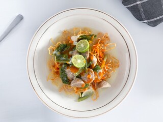 Indonesia food namely Mie Kering or crispy fried noodles with toppings chicken, meatballs, vegetables, beaten egg and thick broth. Commonly popular in Asia food.