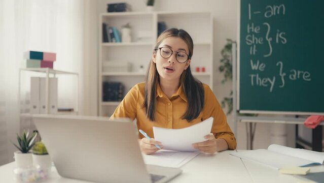 Beautiful Asian woman teaching English language course online, private tutor