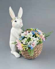 easter composition with bunny and flowers on gray isolated neutral background