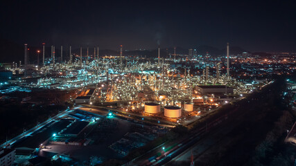 industrial area production plant or refinery crude oil and gas for transportatioon and export, aerial photography at night scene from drone,