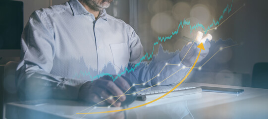 Crypto currency and stock market business investment Trader analyzing graph data on virtual screen