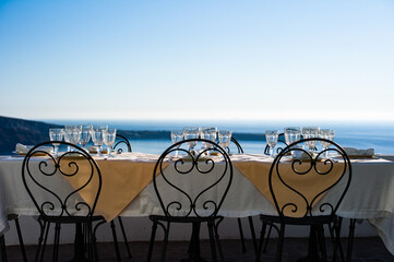 a dinner table ready for the beautiful sunset of Oia Santorini