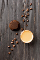 Obraz na płótnie Canvas Waste coffee, cup of espresso on a black wooden background top view.