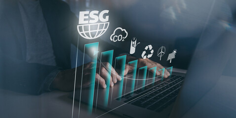 Businessman using laptop computer. ESG environmental social governance concept. Business strategy