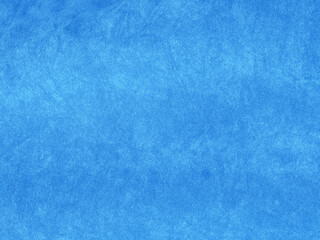 Light blue velvet fabric texture used as background. Empty light blue fabric background of soft and...