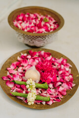Fototapeta na wymiar red rose petals in a container in Javanese custom
