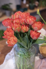 Red flowers in the glass with water