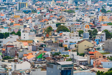 Morning in Vung Tau seen from above, with the most beautiful sea waves, coastline, streets, buidling, coconut trees and Tao Phung mountain in Vietnam. Travel concept.