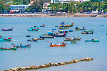 Fototapeta premium Morning in Vung Tau seen from above, with the most beautiful sea waves, coastline, streets, buidling, coconut trees and Tao Phung mountain in Vietnam. Travel concept.