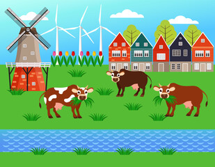 Dutch countryside. Cows in the pasture eating grass. Famous symbol of Holland, windmill with beautiful nature and houses.
