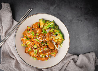 Delicious sweet chopping chicken rice, sesame seeds, sliced spring onions, broccoli, and vegetables. Asian food, Japanese food. Top view