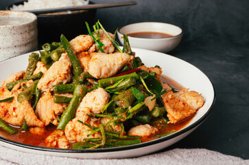 Close up, Tasty Stir-fried pork and red hot curry paste with or long bean and Ingredients are oyster sauce, fish sauce, sugar, kaffir lime leaves in the dish Eat with cooked rice. Thai food