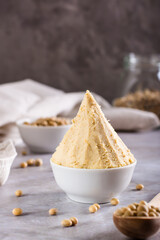 Japanese seasoning miso fermented from soy and koji rice in a bowl on the table. Vertical view