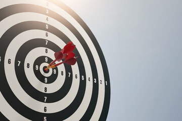 Red dart arrow in the center of dartboard on bullseye business success concept ,3d rendering