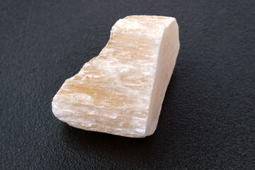 Red Gypsum stone mineral, black background, close-up, black background