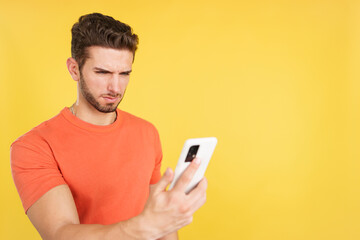 Worried caucasian man using a mobile phone