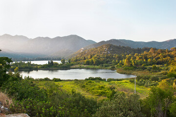 a lake,  in a picturesque valley amongst the mountains. Landscape with mountains and lake