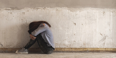 depression sad alone woman sit in dirty abandon building after raped violence against by bandit....