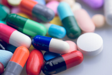 capsules tablets pill on white table. light shiny to blister pack of the capsules