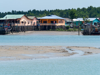 Stilt kampong houses during low tide in Pulau Ketam, Malaysia. Pulau Ketam is near Port Klang.