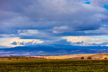 Obraz premium Autumn fall landscape in Kakheti region, Georgia. Beautiful view. Dramatic sky. Mountains in the background.